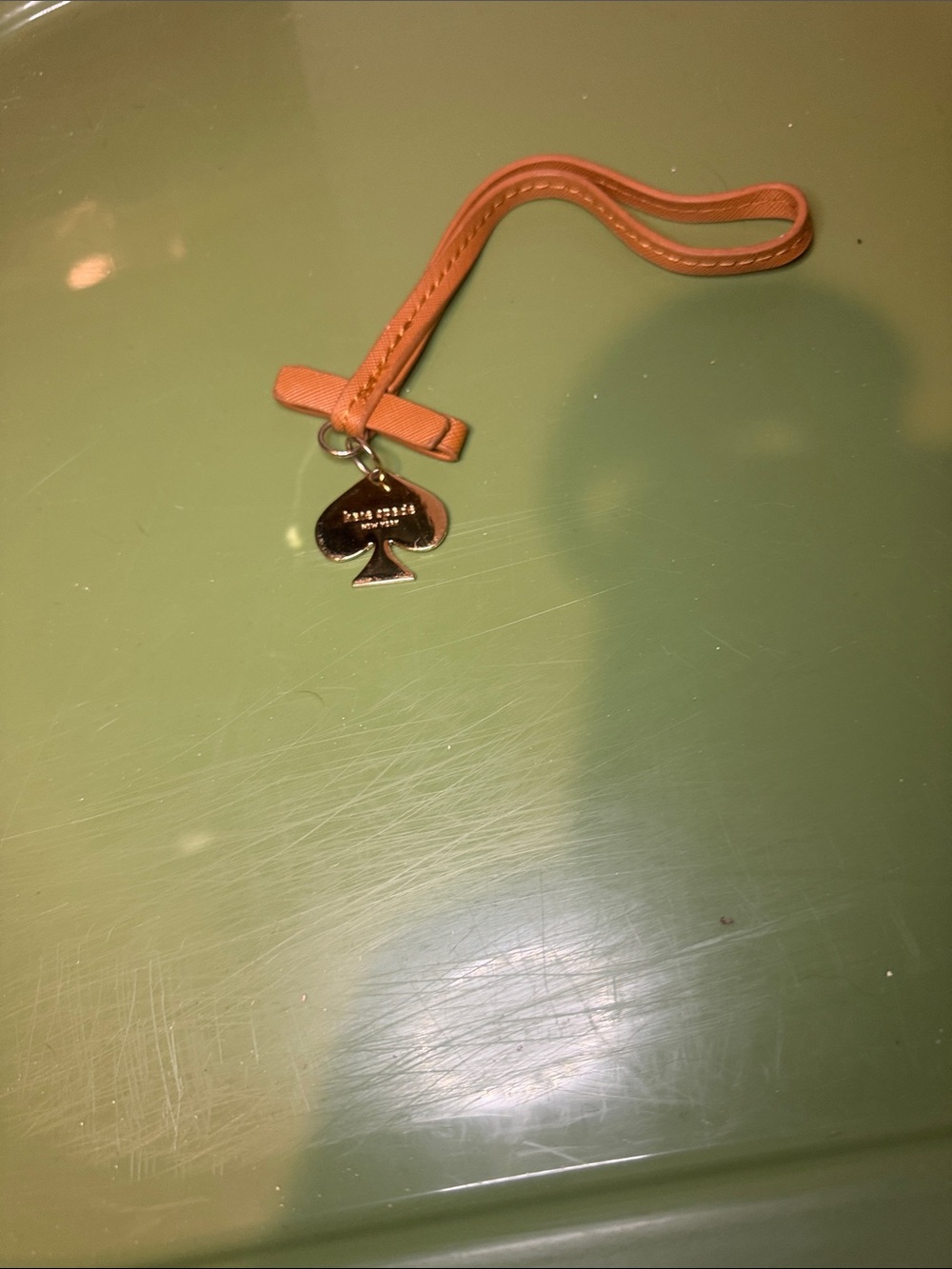 kate spade tan leather wristlet charm with gold spade pendant